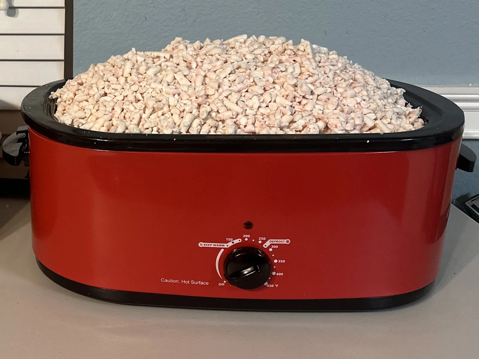 Beef suet wet-rendering at low controlled temperature in a stainless roaster