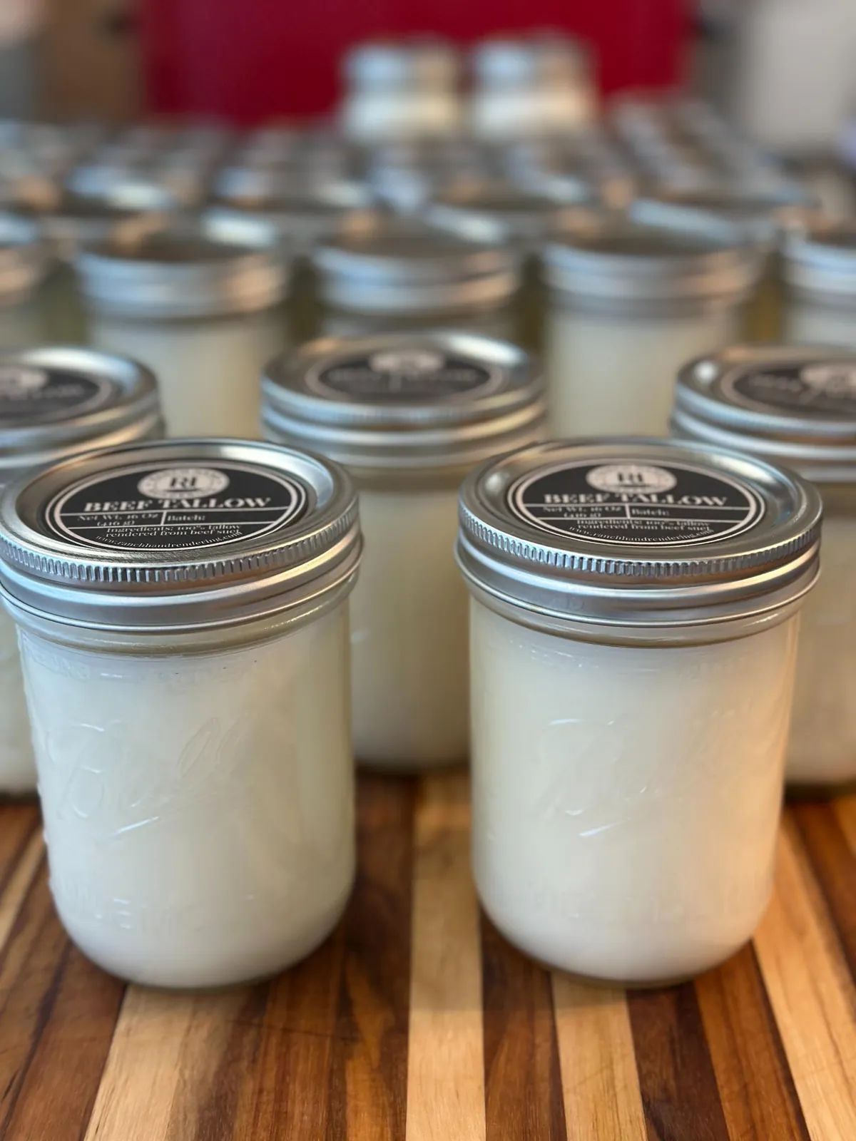 Glass jars of Ranch Hand Rendering grass-fed beef tallow for the kitchen