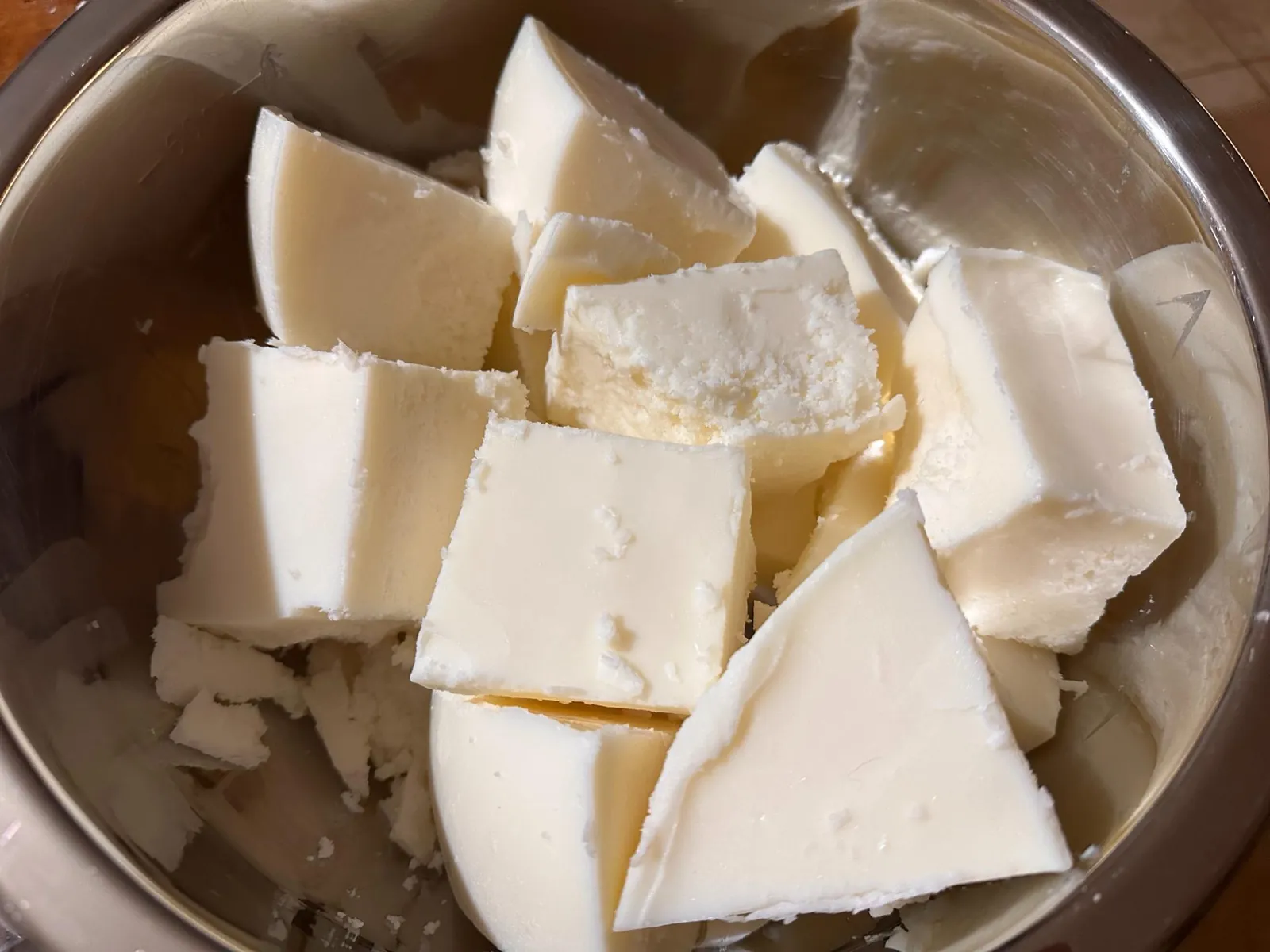 Filtered beef tallow set into clean white chunks after wet rendering and fine straining